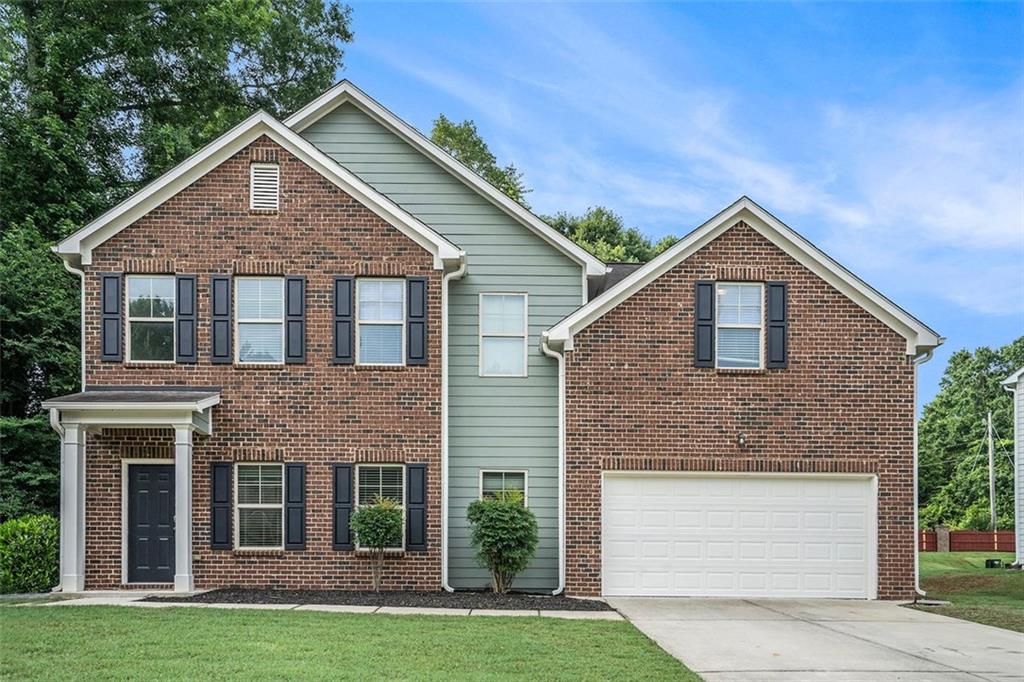 This two-story builder-style home features a spacious 5/3 layout, a two-car garage, and a well-maintained yard. The property is in excellent condition with modern finishes throughout. Its layout offers ample space for larger households or those needing additional flexibility. Ideal for buyers seeking a move-in ready home in a well-kept neighborhood.