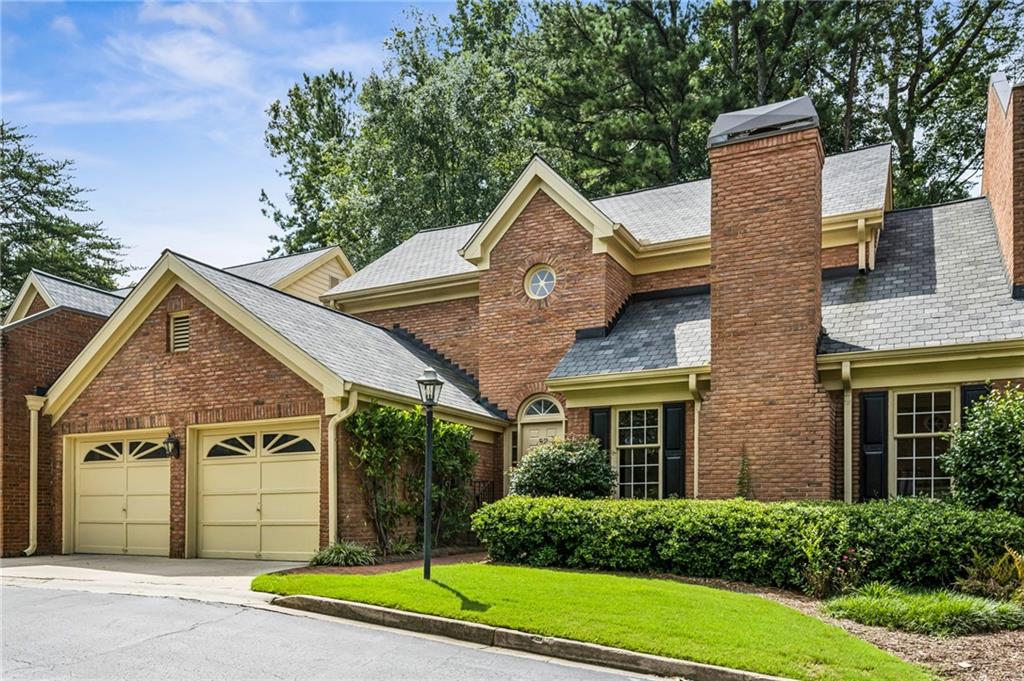Rare primary bedroom ON MAIN in sought after Glenridge Place. Gracious and welcoming foyer with two story ceiling. LARGE, beautifully appointed living room with custom designed coffered ceiling and stunning gas fireplace. Charming kitchen with large island, lots of ingenious storage and separate breakfast area. Generously sized primary bedroom with lovely sitting room. Primary bath boasts double vanity, luxurious whirlpool tub and separate shower. Sizable primary closet with custom design features. Separate dining room, perfect for entertaining. Spacious second floor with three more bedrooms and bonus room. Plenty of room for office(s), exercise equipment and storage. Elegant powder room with Scalamandré wall paper. Easy access into home from two car garage and front steps. Newly redone garage floors. Enjoy the great outdoors on the bespoke SCREENED PORCH with vaulted ceiling and private views. Lots of natural light. Gorgeous custom molding throughout. Designer carpet and hardwood floors (downstairs hardwoods are newly refinished). Tankless water heater and new HVAC too. Great enclave location offers privacy and green space located in the heart of Buckhead near great schools, high end shopping, PATH 400 walking trail, and superb dining.