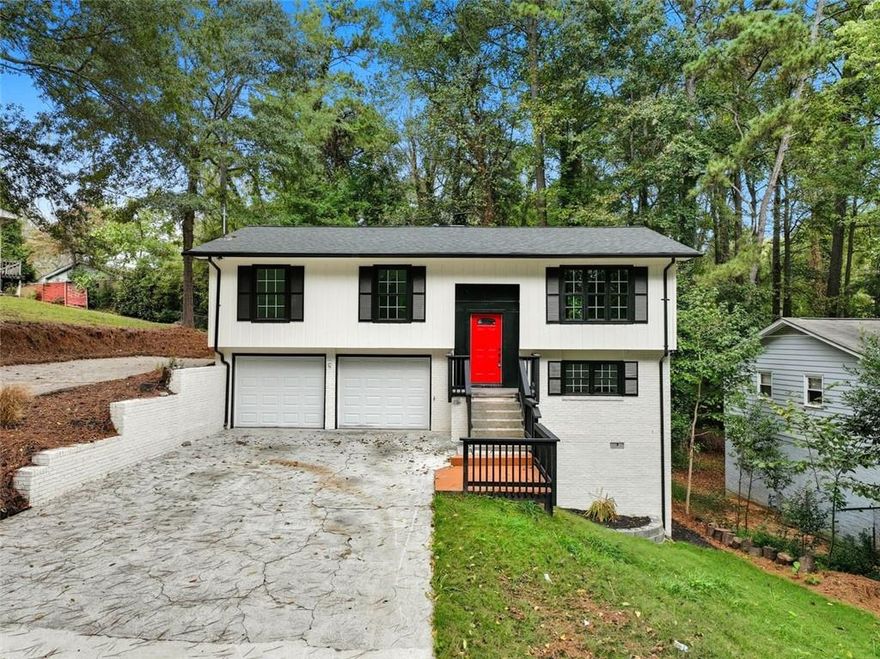 Experience refined living in this beautifully renovated four-bedroom, three-bath on a FINISHED BASEMENT showcasing a sophisticated modern farmhouse design. Thoughtfully crafted interiors feature open living spaces and curated finishes that create an effortless blend of comfort and style. Enjoy a peaceful outdoor terrace framed by mature trees and the convenience of two separate driveways providing ample parking. Ideally situated near I-285 and just minutes from local shopping, dining, and parks, this home offers both elegance and accessibility in a truly desirable setting.