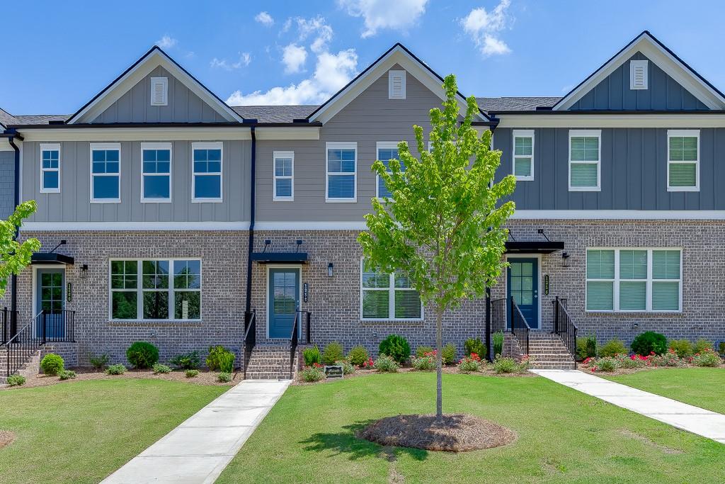 Stunning New Townhome Steps from the Action at Sugar Hill!
Welcome to Lot 46 – The Oakfield Plan (Elevation D), a gorgeous new 3-story townhome perfectly positioned in the heart of Hillcrest Landing—just minutes from the energy and entertainment of downtown Sugar Hill!
Live where the action is! This home is nestled near the famous Sugar Bowl amphitheater, home to year-round concerts, events, and vibrant nightlife. Whether you're catching a live show, enjoying local food trucks, or strolling through weekend markets, you’re always just steps from something exciting. And if you're looking for a moment of quiet inspiration, the highly regarded Sugar Hill Church is just around the corner.
Inside, this rear-entry, 2-car garage townhome delivers top-of-the-line finishes, including luxurious RevWood laminated wood flooring, custom tile accents, and stylish quartz and granite countertops. Every detail has been thoughtfully designed to reflect today’s latest trends, from paint colors to fixtures, creating a polished and inviting atmosphere.
This is more than a home—it’s a lifestyle. Enjoy proximity to:
Downtown Sugar Hill’s charming boutiques and restaurants
The E Center—a premier athletic and recreation facility
The Eagle Theater and scenic walking trails
Major highways I-985 and GA-400, plus quick access to the Mall of Georgia
Note: Interior and select exterior photos are of the model home and are used for illustrative purposes only.
Don’t miss this incredible opportunity to own a stylish new home with unbeatable location and amenities. Come experience the best of Sugar Hill living at Hillcrest Landing!
All applicants must have a 620 minimum credit score, no criminal history or evictions, and 3x monthly income.