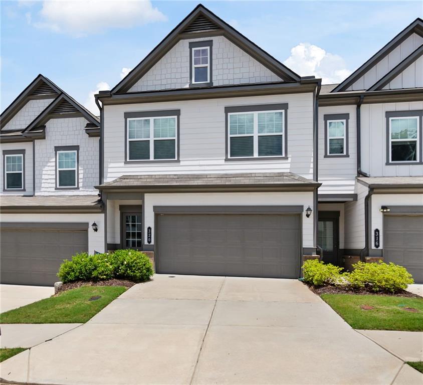 Welcome to this beautifully maintained 2022-built Ellison townhome, offering modern comfort and a prime location between the vibrant downtowns of Roswell and Woodstock. With stylish design and a thoughtful layout, this home is move-in ready and perfect for those seeking low-maintenance living without compromising on space or style. Step inside to a gracious foyer that opens into an expansive main living area, seamlessly connecting the kitchen, dining, and family room—ideal for entertaining or cozy evenings at home. The kitchen features sleek cabinetry, a center island, and rear yard access for easy outdoor dining and grilling. Upstairs, the spacious owner’s suite offers a luxurious retreat with a large en-suite bath and an oversized walk-in closet. Two additional bedrooms, a full bath, and a convenient second-floor laundry room complete the layout. Located in the desirable Concord community, this home provides easy access to parks, shops, dining, and top-rated schools—all in a thriving corridor of North Metro Atlanta. Don't miss this opportunity to enjoy like-new construction without the wait!