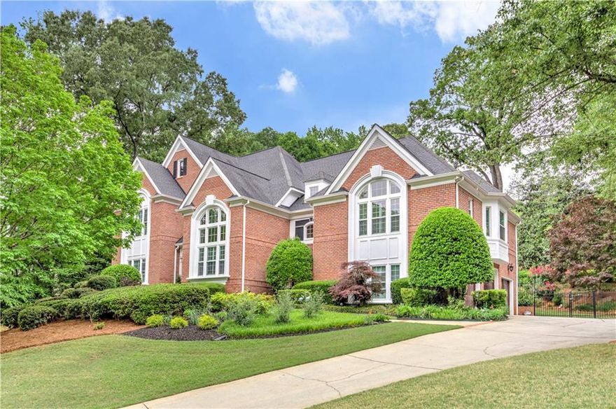 5 Bedrooms/4.5 Baths with over 6000 sq ft of living space nestled on just over 3/4 acres in the prestigious Giverny neighborhood of East Cobb, this stunning home is a true gem that offers both elegance and comfort. Just a short stroll from the serene Sope Creek Park, the location off Paper Mill Rd is ideal for those who cherish nature and tranquility. As you step into the grand foyer, the high ceilings and rich dark hardwood floors immediately set the tone for sophistication. The expansive great room is bathed in natural light, thanks to a wall of windows that frame the breathtakingly landscaped backyard, creating a perfect backdrop for gatherings or quiet evenings at home. The heart of the home is undoubtedly the newly renovated kitchen, designed to inspire culinary creativity. With its bright, white cabinetry, state-of-the-art Bosch appliances, luxurious quartzite countertops, and a generous island, this kitchen is both functional and beautiful. The owner's suite offers a private retreat, complete with his and her closets, a cozy fireplace, and a sitting area that invites relaxation. The exquisite custom marble bathroom elevates the experience, making you feel like royalty. On the upper level, you will find three spacious secondary bedrooms accompanied by two well-appointed bathrooms, ensuring ample space for family and guests. The finished terrace level adds even more charm, featuring updated paint and flooring, along with a convenient kitchen that overlooks a welcoming family space. This home is truly a perfect blend of modern design and timeless elegance.

Property boasts exterior access from the basement leading directly to a charming brick patio, perfect for hosting gatherings or enjoying quiet evenings under the stars. The backyard is a true oasis, featuring a cozy firepit, and ample space for a pool, creating an environment that encourages relaxation and fun. Breathtaking views of the moon illuminates the entire property, providing a magical backdrop for your evenings. Home also showcases a spacious 3-car garage and an enormous formal dining area, ideal for entertaining or creating cherished family memories. Located in a highly-rated school district, with Sope Creek Elementary and Wheeler High School, known for its advanced studies in STEM, this home is perfect for families seeking an exceptional educational environment. Minutes to Merchant's Walk & the Avenues @ East Cobb. Close to Historic Roswell, Marietta Square and Battery! 

Gorgeous curb appeal and landscaping. Backyard ideal for outdoor parties. Fully fenced yard. New windows just installed. High end kitchen appliances and bathroom fixtures. Brand new water heaters recently replaced. Backyard Pool plan design available. In ground trampoline with drainage. Separate entrance for terrace level. Tesla charger in garage.