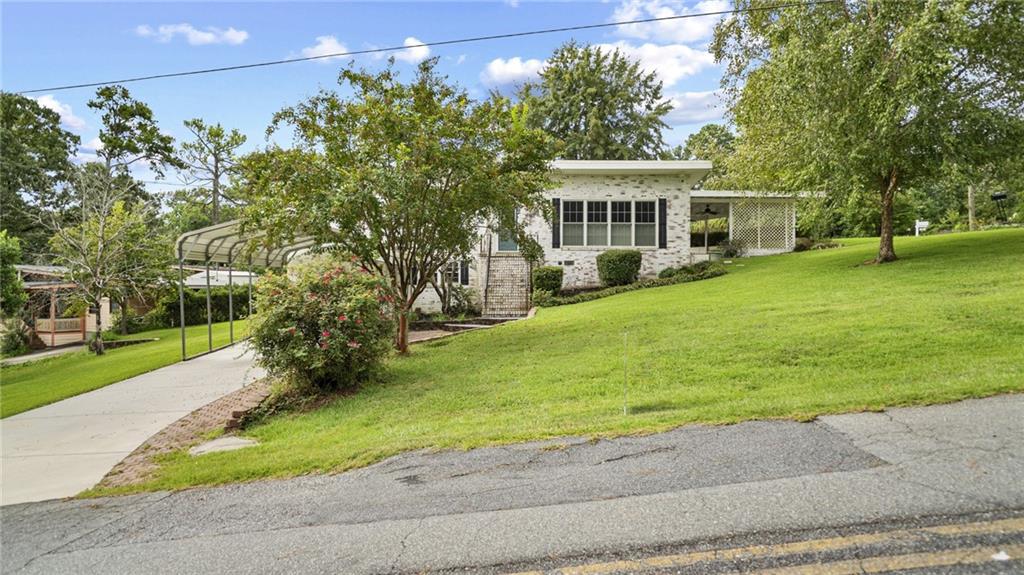 Charming Split-Level on a Corner Lot! This updated home features an inviting layout with an updated kitchen, the spacious lower-level has a bonus room, a full bath, and a fantastic laundry room. Enjoy evenings on the patio—perfect for relaxing or hosting cookouts with friends and family. This is ready for you to make it a home!