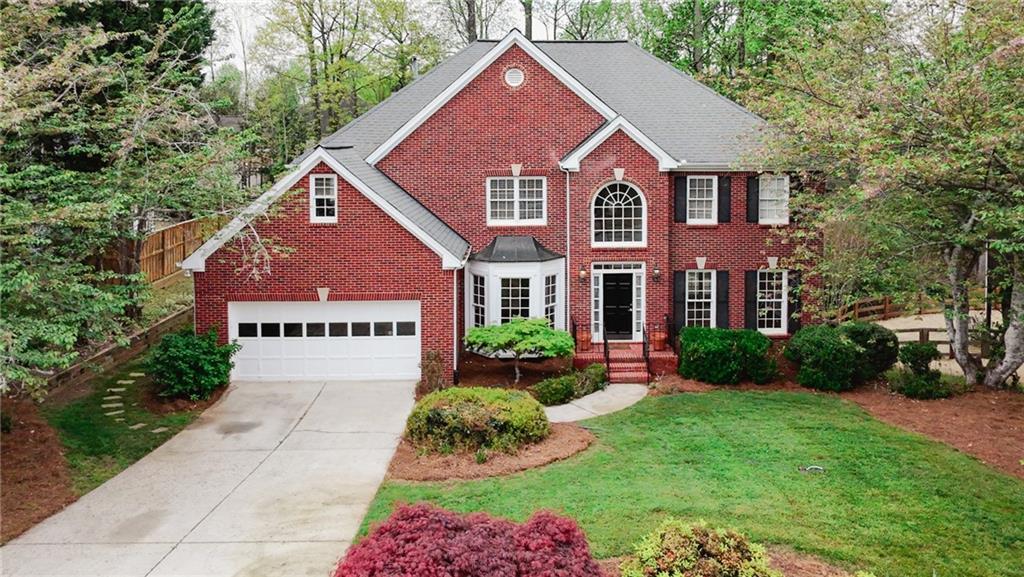 Welcome to 11895 Leeward Walk Circle, Alpharetta, GA 30022
This beautifully maintained residence offers the perfect combination of space, style, and comfort in one of Alpharetta’s most desirable neighborhoods. With 4 generously sized bedrooms and 2.5 baths on the second floor, plus a finished basement featuring 2 additional bedrooms and a full bath, this home is ideal for multi-generational living or entertaining with ease. Enter through a dramatic two-story foyer, where gleaming hardwood floors flow throughout the main living areas. A grand double staircase, accessible from both the foyer and the living room, leads upstairs to a catwalk overlooking the soaring two-story living room—anchored by a stunning floor-to-ceiling stone fireplace and bathed in natural light. The open-concept kitchen flows seamlessly into the living room and breakfast room which has a view and entry to the uncovered deck and backyard, creating an ideal space for family time or gatherings. The home also features a formal dining room with a charming bay window, and a formal living room that can easily be transformed into a home office with views of the covered back deck. Enjoy alfresco dining or quiet relaxation on either the covered or uncovered rear decks, offering flexibility for any occasion—from sunny afternoons to evenings under the stars. The finished basement, complete with brand new carpet, offers versatile space perfect for a media room, playroom, office, or private guest suite. Located in a vibrant, amenity-rich community featuring a swimming pool, tennis and pickleball courts, open playfield, and a playground, this home has something for everyone. Just minutes from downtown Alpharetta and Halcyon, top-rated schools, and major conveniences, this move-in ready home checks all the boxes. Don't miss your opportunity to make this exceptional property your forever home!