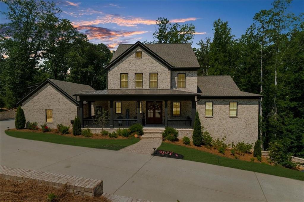 Welcome to Your Dream Home – Where Luxury, Design, and Comfort Converge
Tucked away on a serene and private 1.2-acre lot in the sought-after Andersen Farm community, this exceptional custom residence—completed in 2022—offers a flawless fusion of sophisticated finishes, thoughtful functionality, and timeless elegance. Every element of this home was curated with purpose and precision to create a living experience that is as elegant as it is effortless.
From the moment you step onto the inviting front porch, you’re greeted with timeless architectural detail and a sense of calm that continues throughout the home. At its heart lies a chef’s kitchen designed to impress and perform, featuring premium Thermador appliances, striking quartz countertops, a walk-in pantry, pot filler, oversized island, and a sleek butler’s pantry—ideal for entertaining or everyday indulgence.
The kitchen flows seamlessly into a sun-drenched great room with wood-beamed ceilings, a stunning fireplace, and walls of windows that bring the outdoors in—creating a space equally suited for intimate gatherings or lively celebrations.
The main-level primary suite is a private sanctuary, complete with its own laundry area, a luxurious spa-inspired bath with a soaking tub, oversized walk-in shower, dual vanities, and an enviable custom closet with tailored storage solutions.
Upstairs, you’ll find three spacious secondary bedrooms—each with its own en suite bath—and a second laundry room for added convenience. No detail was overlooked.
The fully finished terrace level is an entertainer’s dream, featuring a custom bar with dishwasher and mini fridge, a spacious media and lounge area, a private guest suite, full bath, and a dedicated home gym—offering flexibility for hosting, relaxing, or recharging.
Additional features include a three-car garage on the main level, an oversized mudroom that connects to a partially fenced backyard, and a thoughtfully placed dog washing station—perfect for pet lovers. Unwind year-round on the charming screened-in porch overlooking the tranquil wooded backdrop—your own personal retreat.
All of this, just minutes from the natural beauty of Kennesaw Mountain, award-winning healthcare at Kennestone Hospital, and the vibrant shops and dining of historic Marietta Square—less than a mile away. Quick access to major interstates ensures convenience without compromise.
This home embodies the best of West Cobb living: luxury, comfort, privacy, and proximity. Discover the rare opportunity to own a home that not only meets your needs—but exceeds your dreams.