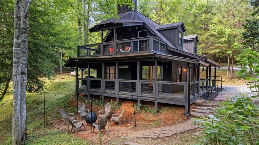 ONE OF A KIND OPPORTUNITY WITH 2 CREEK FRONT REMODELED CABINS ONLY 8 MILES FROM DOWNTOWN HELEN! 232 FEET OF CREEK FRONTAGE WITH A COVERED DECK/PATIO! LARGER CABIN FEATURES-- 3 BED/ 2 BATH, ALL NEW-- ROOF, HVAC, HOT WATER HEATER, FLOORING, LIGHTING, INTERIOR AND EXTERIOR PAINT, TILED SHOWERS, SHIPLAP WALLS, WINDOW BLINDS, VANITIES, AND LARGE DECK OVERLOOKING THE BUBBLING CREEK. SMALLER CABIN FEATURES-- 2 BED/ 1 BATH, ALL NEW--- ROOF, HVAC, HOT WATER HEATER, INTERIOR AND EXTERIOR PAINT, KITCHEN CABINETS, GRANITE TOPS, SS APPLIANCES, VANITIES, FLOORING, WINDOW BLINDS, TILED SHOWER, AND BACK PORCH OVERLOOKING THE BUBBLING CREEK. ALL NEW GRAVEL DRIVEWAY! THIS WOULD BE PERFECT FOR ANY SCENARIO--- LIVE IN ONE AND RENT THE OTHER, LONG TERM RENTAL, OR A LARGE FAMILY ON A SMALL COMPOUND.