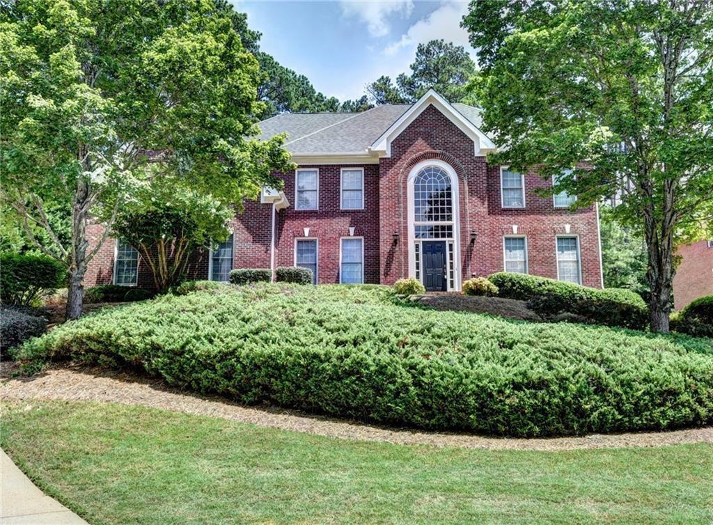 Great Johns Creek location in sought after neighborhood and schools. Granit open kitchen opens to large vaulted family room with fireplace and rear stairs. Office/bedroom on the main level. Rear patio overlooking private fenced back yard.