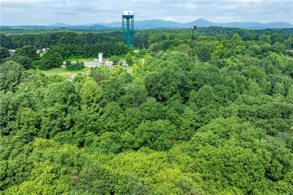 Don't miss this rare opportunity to own 9.88 acres of unrestricted land, currently zoned agricultural—ideal for building your dream home, establishing a mini-farm, or creating a peaceful country retreat. This mostly wooded land lays well and offers complete privacy. Build your custom home surrounded by nature, and the quiet of rural living—all just 5 minutes from downtown Jasper and Highway 515. County water is available, adding even more convenience. Currently there is an old chicken house left on the property that is being used for storage. An adjoining 9.88-acre parcel is also available, offering a total of 19.76 acres and endless possibilities. Bring your vision and make this special property your own!