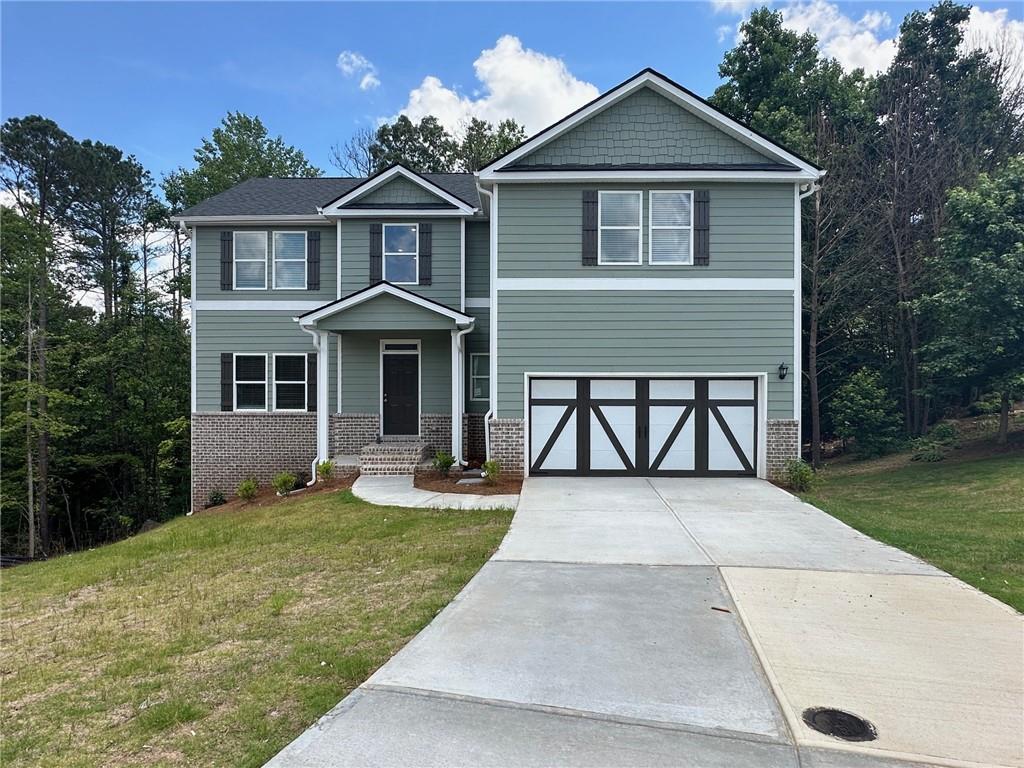 PRICE IMPROVEMENT! Search no further...Welcome home to Timberlands in Dallas, GA. Don't miss out, only a few opportunities left to make this great location, home and community yours in 30 days or less. Hurry for this newly constructed Adam plan on an unfinished daylight walk-out basement is priced to sell and won't last long. Enter into a two-story foyer with a separate dining room and living room. This open-concept floor plan design is great for entertaining family and friends in the great room with views and easy access to the kitchen and breakfast area! Features include 36" soft-close cabinets, stainless steel appliances, LED lighting throughout, granite countertops in the kitchen and full bathrooms, LVP flooring throughout the main floor plus wet areas, plush textured carpeting in bedrooms and closets to name a few. Upstairs the large primary ensuite has lots of natural lighting with dual vanity, separate shower, tub, and water closet. Secondary bedrooms are spacious with sizable closet. Great Homebuyer incentive available with the use of the affiliated mortgage lender. Please note some photos are stock images used for illustration purposes only.