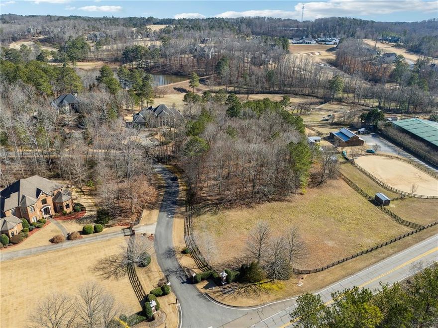 3-acre homesite located in The Paddocks of Alpharetta, an exclusive five-home enclave, offers a rare opportunity to build your dream estate in a highly desirable location. This flat, partially cleared, and partially wooded lot provides the perfect balance of open space and natural privacy. With the advantage of Cherokee County taxes and zoning for Creekview High School, this property combines desirable tax benefits with top-rated schools.

Just five minutes from 7 Acre BarnGrill, Publix, and Scottsdale Farms, this homesite is ideally positioned for both convenience and lifestyle. Golf enthusiasts will appreciate the close proximity to The Manor Golf & Country Club, Hawks Ridge Golf Club, and Echelon Golf Club, while equestrian lovers will enjoy being in the heart of North Georgia’s horse country, surrounded by scenic horse farms. A short drive leads to Downtown Crabapple in Milton, Downtown Alpharetta, and Avalon, where high-end shopping, dining, and entertainment await. This exceptional property provides the perfect balance of tranquility and accessibility.