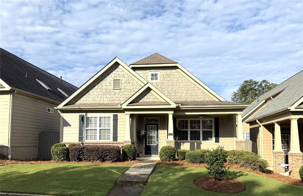 What's not to love about this great Active Adult Community? The Glens at Mountain Brook is a fantastic, gated community in a great location that is near I-575, downtown Woodstock, tons of shopping, dining and entertainment. You are also not far from all that Downtown Roswell has to offer as well! This fantastic, 1-level home features 10-foot ceilings and laminate wood flooring throughout, tons of windows and skylights in the Great Room making the home bright and cheerful. The Primary Suite features a tray ceiling with access to your private patio area, a large Primary bathroom with double vanity, and large walk-in closet with custom cabinetry. This home is move-in ready, and all appliances (including refrigerator, washer & dryer) convey at closing. The community features a Clubhouse, pool, walking trails and so much more. From the spacious kitchen you have views to the Great Room with it's gas log fireplace. This home also features a beautiful, rocking chair front porch as well as a private patio area that is great for grilling, relaxing and entertaining guests. The HOA covers exterior maintenance, including paint and roofs! Come check this home out today!