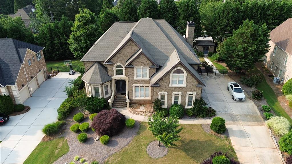 Gorgeous Dogwood Manor Estates Home… This former model home is 5Bedrooms/4.5 BAs offers palatial open floorplan with a gourmet kitchen and a daylight basement.