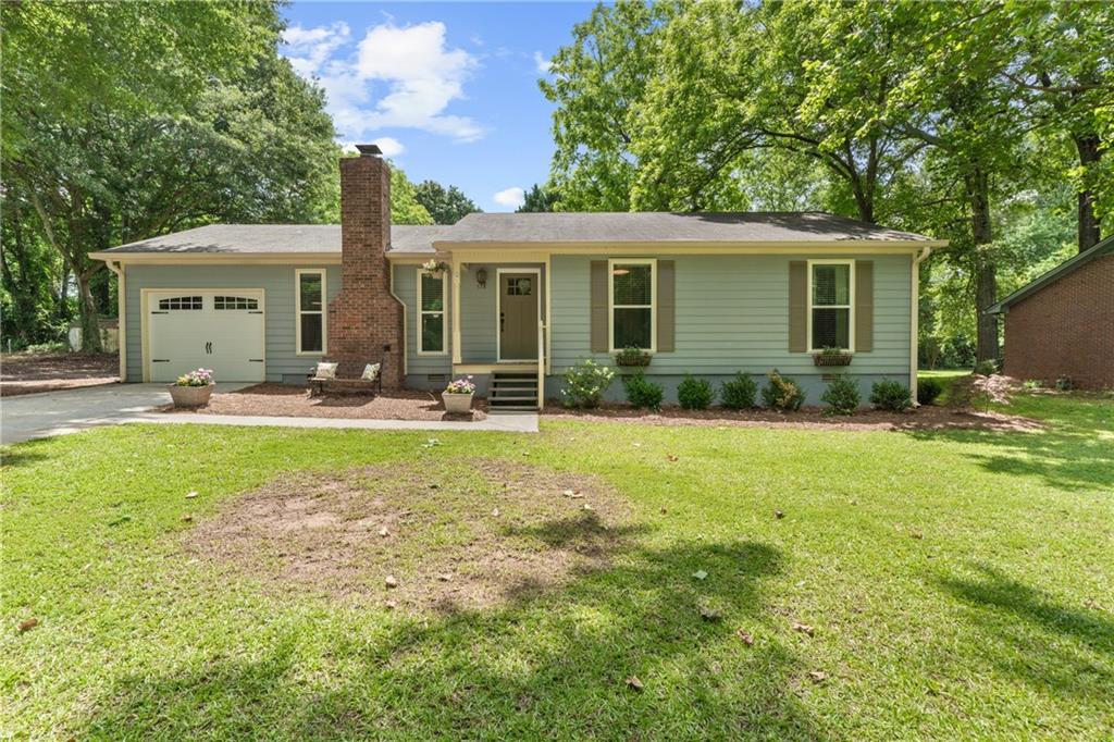Located just outside of Madison’s Historic District and within walking distance to the downtown area and award-winning Morgan County Schools, this 4 bed 3 bath home is in the perfect spot. As you enter the driveway, you will find an attached garage, as well as a detached two car garage behind the home, used for parking or extra storage. Inside the home, hardwood floors and a brick fireplace create a cozy and warm feel to the space. Having a split bedroom house plan, the master is separated from the other three bedrooms for added privacy and a more spacious feel. The master bedroom features sliding barn doors and a walk-in closet. The master bath has double vanities, a walk-in glass shower, and a soaking tub for relaxing after a long day. Overlooking the dining area, the kitchen has stainless steel appliances and a breakfast bar. Off of the screened in porch, also with a fireplace, the door opens to a fenced-in and bright backyard, ready for entertaining, relaxing, and making memories. Book an appointment today to view this beautiful home, it won’t last long!