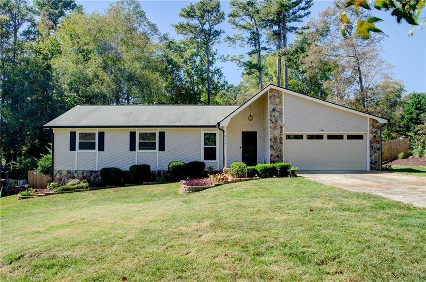 Enjoy coming home everyday to 4799 North Trail, featuring single level living with a backyard oasis and beautiful sunroom. Discover the perfect blend of comfort and convenience in this move-in ready 3-bedroom, 2-full-bath ranch home, nestled in sought-after East Cobb. Perfect for families, professionals, or empty-nesters alike. The heart of the home is the expansive great room, featuring LVP floors, a vaulted ceiling, and a cozy fireplace perfect for chilly winter evenings. Elegant wainscoting, fresh interior paint and new carpet in the bedrooms create a polished yet welcoming vibe throughout. Adjacent to the kitchen, the glass enclosed sunroom offers a bright and airy place to lounge while overlooking the deck and pool. The outdoor space features an above-ground saltwater pool and a deck encircling half the pool, making for an ideal gathering spot for barbecues and hosting family & friends for game day. The quarter-acre lot allows for this backyard oasis while retaining a spacious, fenced-in, landscaped yard for kids and pets. North Landing also offers a VOLUNTARY homeowners association with swim/tennis/pickleball, a clubhouse, 14-acre lake for fishing and an 18-hole disc golf course. Book your showing today!