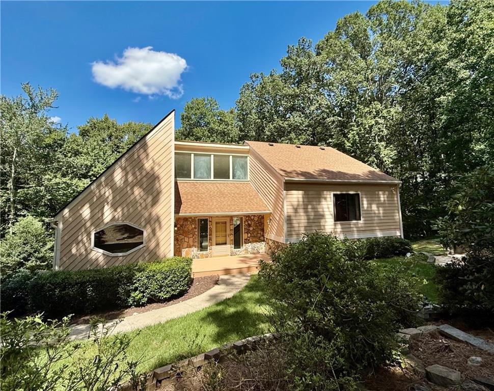 Tucked away on a quiet cul-de-sac in Jefferson Township, this spacious four-bedroom, three-bath home offers a flexible layout designed for both comfort and entertaining. Multiple living areas provide plenty of options for relaxing or hosting, including a family room with a striking stone fireplace and large picture windows overlooking the private, wooded backyard. A separate den with its own fireplace opens directly to the deck. The kitchen features a breakfast bar, sunny dining nook, and access to the screened-in porch, creating the perfect hub for everyday living. A formal dining room adds even more space for gatherings. The home also includes a two-car garage, a beautifully landscaped front yard with great curb appeal, and access to optional swim and tennis amenities within the community. With its generous size, thoughtful layout, and prime location in the sought-after Lassiter High School district, this home presents a wonderful opportunity to make your own.