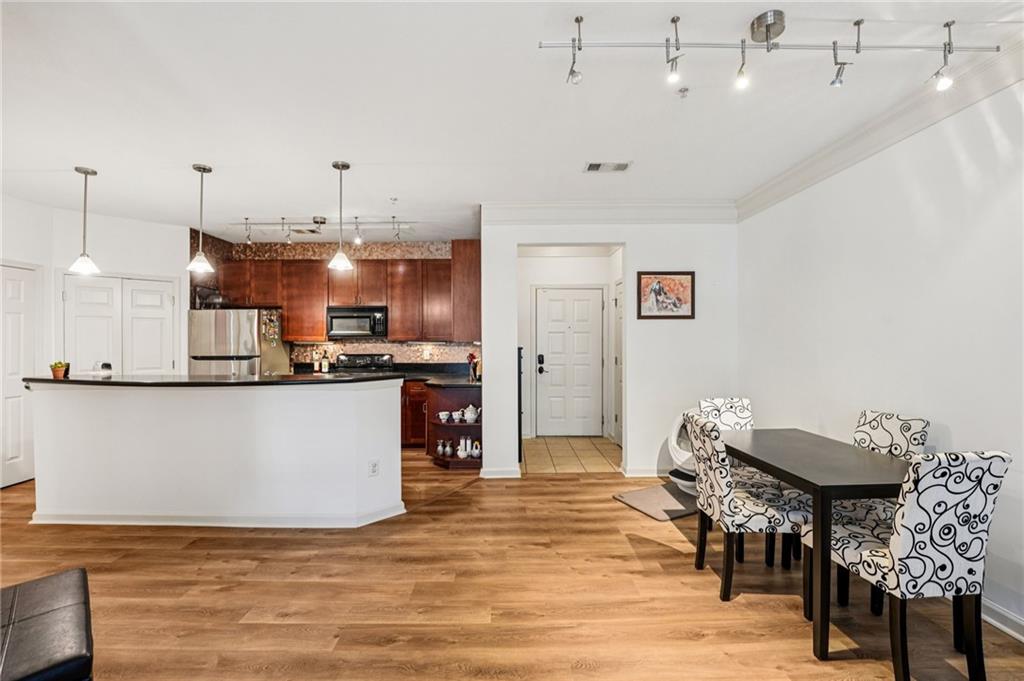 FHA-approved! This stylish 2-bedroom, 1-bathroom condo in the highly desirable Art Foundry community combines modern comfort with the ultimate city lifestyle. Nestled in a quiet spot right next to IKEA yet only steps from the buzz of Atlantic Station, this home delivers the best of both worlds—peace when you want it and endless excitement when you step outside.
Inside, the bright open-concept layout offers plenty of natural light, in-unit laundry, and modern finishes. You'll also enjoy the convenience of two reserved parking spaces—a rare find in city living.
Step out your door and walk to Publix, Target, restaurants, shops, and Regal Cinemas. Midtown, West Midtown, and Georgia Tech are just minutes away, with quick access to I-75/I-85 and MARTA to make commuting effortless.
Resort-style amenities include a sparkling pool, fully equipped fitness center, clubhouse, spa treatment rooms, business center, and secure gated access. If you've been looking for low-maintenance living in one of Atlanta's most vibrant neighborhoods, this condo is the one to see!