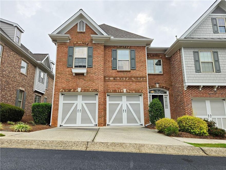 Welcome to this bright corner-lot home set within a sought-after gated community that includes a sparkling community pool. The main level features beautiful hardwood floors that create a warm and inviting atmosphere, flowing seamlessly through the open living and dining areas. Upstairs, plush carpet provides comfort in all three generously sized bedrooms, including an oversized primary suite complete with a custom built-in closet system that maximizes storage and organization. Every room in the home is designed with space and functionality in mind, and multiple additional closets throughout offer ample room for all your essentials.

Natural light fills the interiors, highlighting the thoughtful layout that balances style and everyday convenience. The fenced backyard has been tastefully landscaped, creating a lush private garden ideal for entertaining, gardening, or enjoying a quiet moment outdoors. Perfectly located just 5 miles from Avalon and GA-400, and minutes from shopping, dining, and top-rated schools, this home offers both comfort and convenience in one package. Whether you’re hosting gatherings in the open main level, retreating to your oversized primary suite, or spending time in your private outdoor sanctuary, this property truly delivers a lifestyle of ease and enjoyment. No HOA Long-Term Rental restriction.