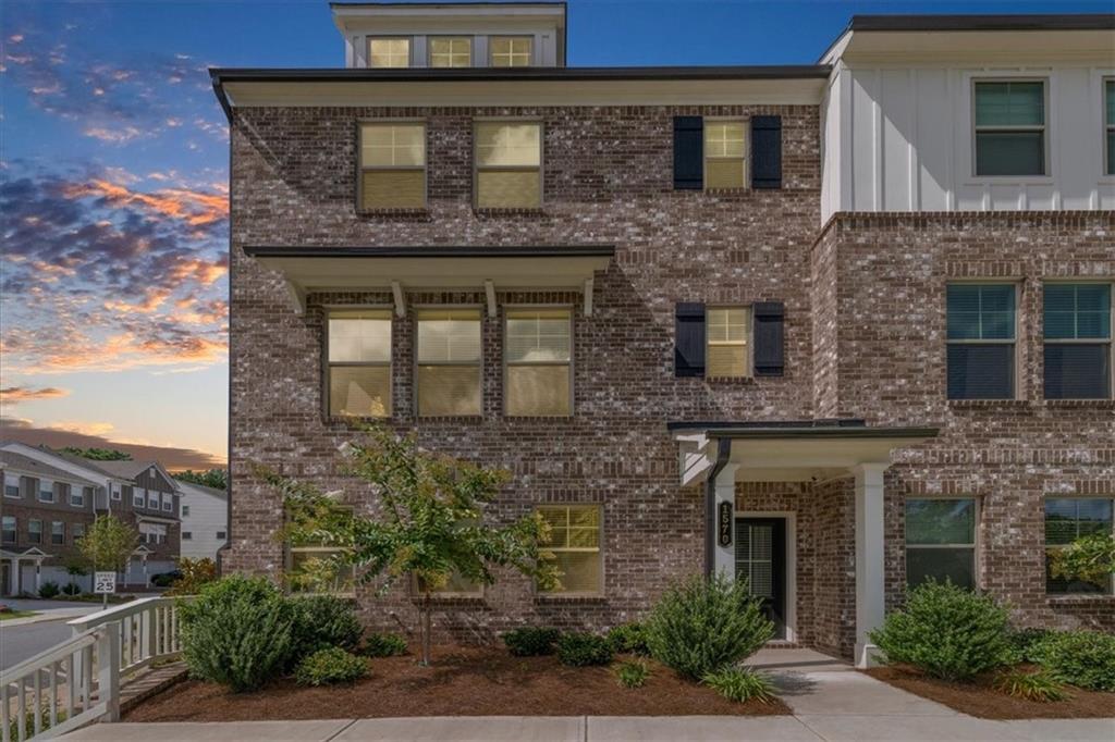 Welcome to 1570 Halbrook Pl. SW located in beautiful South Cobb! This end unit townhome is move in ready! Only 1 year with plenty of upgrades! As you enter the the home, you have a welcoming entry foyer. There is a full guest suite with full bath on the main level of the home, as well and the 2 car rear entry oversized garage. The second level of the home features an open concept family room with fireplace, eating area, and beautiful kitchen with plenty of cabinet space, granite countertops, and a large walk in pantry. There is also access to the oversized rear deck. There are tons of windows on for lots of natural light. Upstairs features an additional guest bedroom with private bath and walk in closet, full laundry room, and the primary suite with private bath, and walk in closet. The primary bath has double sinks, a private toilet room, and walk in shower. This unit has beautiful floors, great accent walls, and beautiful lights and fans through out. Faux wood blinds through out. Level private driveway. Easy walk to the community mailboxes, and firepit area. You are close to HWY 285, Truist park, Cobb Galleria, Cumberland Mall, and so much more! Call today to learn more about this great home!