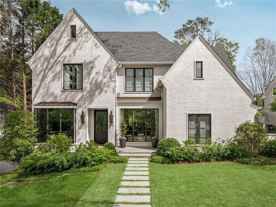 Introducing one of the most bespoke custom homes ever built in Morningside — Atlanta's favorite Intown walkable neighborhood. 
An Atlanta dream team of architect Linda MacArthur, builder Avalon Custom Homes, and designer Violet Marsh interiors have created a masterclass in design, craftsmanship, and sophistication. This exceptional residence is the pinnacle of luxury living, and seamlessly blends modern elegance with timeless finishes, featuring thoughtfully curated spaces across every level. 
Located on a prominent and desirable street, this architectural gem offers incredible curb appeal. Enter through a glass and steel door flanked by Bevolo lanterns into a refined foyer with a subtle coved ceiling. A sophisticated, serene study or living room features mitered corner floor-to-ceiling windows, while the banquet-sized dining room invites effortless entertaining.
An exquisite bar anchors the main floor, complete with a hammered nickel sink, floating glass shelves, antique mirror wall, ice machine, and dual beverage refrigerators. 
The chef's kitchen is a true showstopper, featuring a 48” Hestan range (Thomas Keller), custom Karpaty cabinetry, honed quartzite countertops and backsplash, oversized island and professional grade Miele refrigerator and freezer columns. A double Miele convection/steam oven and an expansive scullery with a second dishwasher and custom cabinetry round out this culinary haven.
Bathed in natural light, the "window box" breakfast room features floor to ceiling windows on three sides, flowing effortlessly into a cozy family room and sunroom, anchored by a dramatic dual-sided gas fireplace. Accordion doors open to an elegant porch, with Ipe wood decking and remote control screens, ideal for year-round entertaining.
A showpiece powder room features a hand-painted mural and a custom curved black oak vanity. Integrated closets, a well-appointed white oak Karpaty mudroom, and meticulous attention to detail elevate the entire main floor.
Upstairs, discover four generously proportioned bedrooms, each featuring custom ensuite bathrooms and a laundry room concealed behind double pocket doors.
The luxurious primary suite is a private sanctuary, complete with 14' wood clad ceilings, a custom walk-in closet, morning kitchen (with mini-fridge and filtered tea pot filler), and a marble-clad bathroom. Enjoy dual vanities with Porcelanosa glass tile backsplash, Waterworks rain and dual shower heads, jetted soaking tub, heated floors, towel warmer, Toto toilet, and discreet in-drawer electrical outlets.
The third level offers incredible flexibility, with a large bonus room ideal for a home office, playroom, or media space. Additional features on this level include a private office, and a mirrored cove gym.
Designed for entertaining and indulgence, the terrace level boasts a 1,000+ bottle climate-controlled wine room, a second kitchen with dishwasher and refrigerator, a spacious living room, a game/pool room, and a guest suite with full ensuite bath. A second laundry room doubles as a pool changing area, while a dedicated full bathroom and a commercial-grade “laboratory” with high-level exhaust, electrical and drainage complete the space.
Imagine spending the summer in your own resort-style completely private backyard, featuring turf grass, professional landscaping, a 50-foot UV-filtered pool and an outdoor shower. The built-in Lynx grill and a generous dining area make this the perfect place to gather with family and friends. A large patio for al fresco dining and entertaining completes the space.
Add a kitchen level 3-car garage with epoxy flooring, whole-home Savant system for control through one app, surround sound wiring, spray foam insulation, pocket doors throughout, whole-house water filtration and so much more.
This home is not only where you will live — it's a statement. A rare opportunity to own a one-of-a-kind estate in one of Atlanta’s most coveted, walkable neighborhoods.