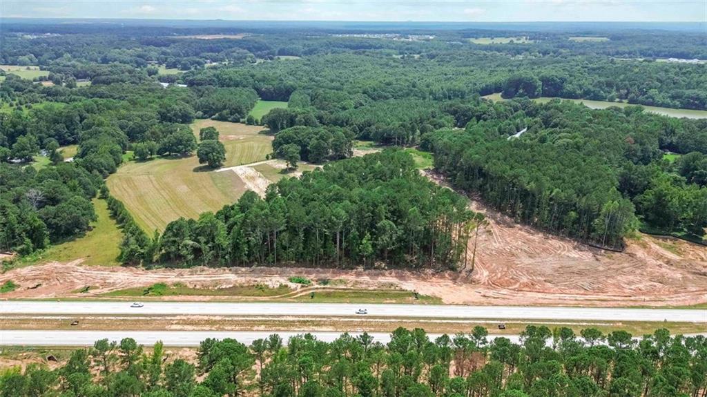 Outstanding 2.153-acre tract located directly off Highway 316 with approximately 432 ft frontage — superb visibility in one of the region’s most dynamic corridors. The State of Georgia is paving a new access road in front, significantly enhancing accessibility and long-term value.
--Market & Demographic Trends:
Barrow County is experiencing rapid expansion, with population estimated at ~87,000 in 2023, reflecting a 3.06% growth over the prior year
--Traffic & Commercial Activity:
Statewide corridor studies show daily traffic between 15,000–30,000 vehicles east of Winder, with traffic rising to 30,000–40,000 vehicles near the Oconee Connector
--Zoning & Development Opportunity
Neighboring parcels are zoned C-2, supportive of a wide range of commercial uses (subject to rezoning).
Level topography and generous dimensions make it ideal for developers or business owners targeting a high-traffic location with substantial growth prospects.
See DOT project info video here-
https://youtu.be/89pcYEs9tpo
