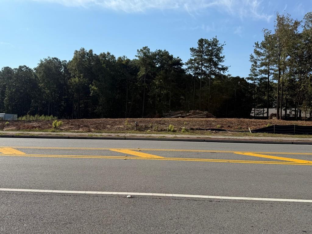 Clear, 1.29 ACRES, level lot ready for your next project! This property is fully prepared and includes an existing building, a water meter, a soil test, and an approved septic tank location. With access to all utilities already, you'll save time and money getting started. Perfect for building a custom home, investment property, or a weekend retreat. Convenient location with easy access to nearby schools, shopping, and is on Highway 5. (Bill Arp Rd) Don't miss this turn-key opportunity to build on a ready lot