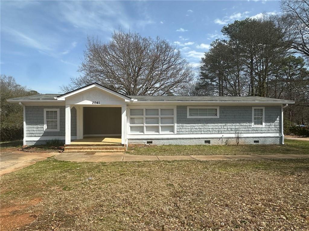 Welcome to 2041 Olive Springs Road SE, Marietta, Georgia 30060—a property that embodies the perfect blend of comfort, convenience, and community. Nestled in the heart of Marietta, this home offers an unparalleled living experience in one of Georgia's most cherished locales. This property consists of 3 full bedrooms and 2 full bathrooms with a lot of natural lighting, NEW FLOORING, BATHROOMS FULLY RENOVATED, with an exception prime Location: Situated in the Olive Springs neighborhood, this property boasts a strategic location that caters to both tranquility and accessibility. Residents enjoy proximity to major highways like I-75, facilitating effortless commutes to Atlanta and surrounding areas. The nearby Smyrna Market Village and Marietta Square provide a plethora of dining, shopping, and entertainment options, ensuring that leisure and lifestyle needs are met with ease. Families will appreciate the top-tier educational institutions serving the area. Marietta City Schools is an International Baccalaureate World School district, offering comprehensive programs from elementary through high school. The district's commitment to academic excellence ensures that students receive a well-rounded and globally minded education. For outdoor enthusiasts, the proximity to Kennesaw Mountain National Battlefield Park provides ample opportunities for hiking, picnicking, and exploring Civil War history. Additionally, Six Flags White Water offers family-friendly aquatic adventures just a short drive away. 2041 Olive Springs Road SE is more than just a property; it's an invitation to experience the best of Marietta living. With its prime location, vibrant community, excellent schools, abundant recreational options, economic vitality, and culinary richness, this home offers a lifestyle that is both fulfilling and engaging. Don't miss the opportunity to make this exceptional property your new home.