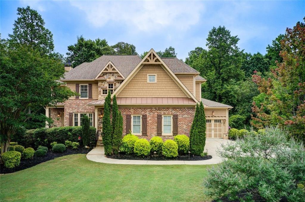 This exquisite custom-built home is a rare blend of architectural excellence and personalized luxury, located in one of Roswell's premier gated communities! This elegant 4 bedroom, 3 and one half bath residence offers the perfect blend of sophistication and comfort, with spacious living areas, rich natural light, and quality finishes throughout. The chef's kitchen opens to a keeping room with fireplace. It has designer cabinets, 36" commercial-style gas cooktop, large island, and double ovens. The luxurious primary suite features a spa-inspired bath and generous walk-in closet. A screened deck overlooks the private one acre yard. A spacious 3-car garage provides ample parking and storage, adding to the home's convenience. Enjoy direct access to the 106-acre Lakhapani Preserve, featuring a 1.5-mile wooded trail, lake, and scenic creeks. This home's location also provides access to all that vibrant Roswell has to offer. Gated privacy, exceptional design, lifestyle convenience, and top-rated schools - this is the one you have been waiting for!