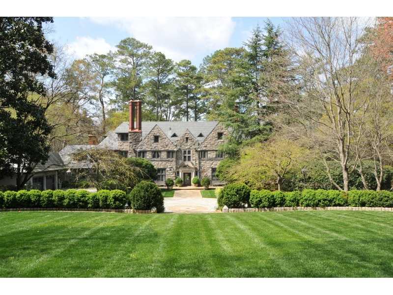 This home is an integral part of Atlanta's history and is one of Buckhead's grand estates. Originally built in 1929 for the president of Ga Power Co. The current owners have restored and expanded the home with a keen eye for detail. The gated drive and manicured grounds provide complete privacy and include a rear courtyard, boxwood gardens, pool, guest house and 4 garages. Top of the line kitchen includes 2 dishwashers and ice maker.  A handsome wine cellar is located on lower level. The guest house has a kitchen, living room, bedroom and bath (not in br/bath count).