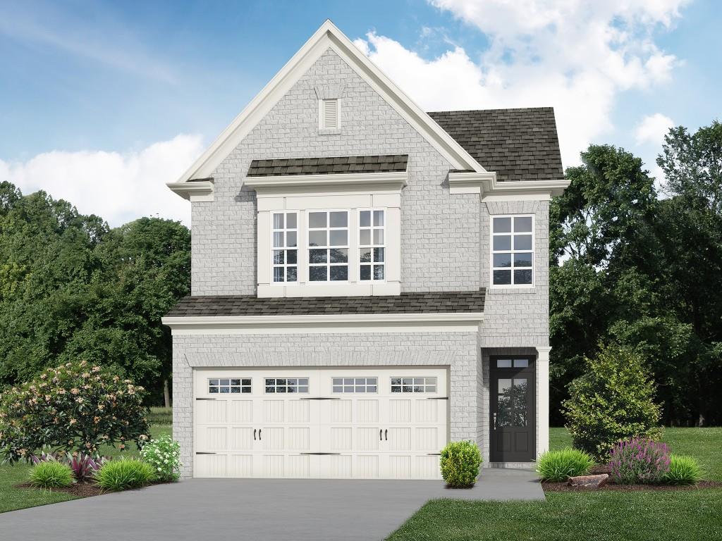 The Pinewood plan built by Southvine Homes. Quick Move-In! This new townhome community is in a highly sought after Duluth location, walkable to historic downtown square to enjoy the festivals and endless dining and shopping options! This popular open concept floorplan is on a premium homesite across from the amenity area and has the perfect flow of function and design. This home offers 3 spacious bedrooms/ 2.5 baths plus upstairs loft with luxury vinyl plank flooring throughout the main level! The open dining area and large family room with modern electric fireplace complete with stunning shiplap surround make for the perfect gathering spot leading out to the private covered rear porch to enjoy the beautiful surrounding woods. The entertainer's kitchen features white painted cabinets with stone counter tops, tile back splash, plus stainless steel appliances! Enjoy relaxing in your luxurious primary suite with natural light, boasting double trey ceilings and a massive walk-in closet. The spa-like primary bathroom offers a double vanity with quartz countertop, tile floor and shower with frameless glass door. Separating the primary suite and secondary bedrooms you'll find the open loft area perfect for home office, playroom, media room, or flex space . Generously sized secondary bedrooms, hall bath with quartz countertop and conveniently located laundry room complete the upstairs. Come and enjoy maintenance-free living complete with community pool and cabana and experience all this prime Duluth location has to offer, Walkable to Rogers Bridge Park, Chattapoochee Dog Park and close to several river recreation areas! The HOA dues are just $220/month and cover the amenity area, exterior maintenance of building and roof, lawn care, and common area maintenance. Ask us about our specific incentive for this homesite of up to $10,000 toward closing costs with the use of preferred lender with binding contract by 07/31/2025.*Interior photos are stock photos of same floorplan*