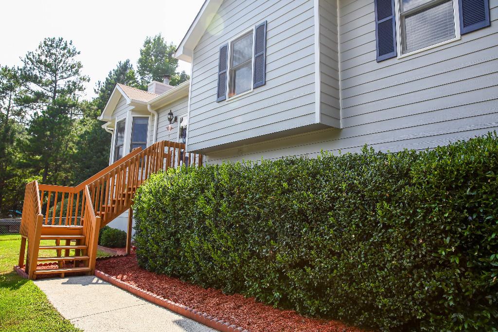 Look no further! This 3 BR/2BA home features a finished basement that could be used as a 4th BR w/ 2 large closets or 1 closet and laundry room as there are W/D hookups on BOTH floors! The living room boasts gleaming laminate floors and tons of natural light. The lot is large and the fenced backyard is wooded and private with a storage building for all of your tools. In addition to a 2 car garage w/ auto openers, there is a 24x32 carport, perfect for your boat/RV! Fresh pain outside, new roof & HVAC . Truly a move-in ready and maintenance-free home!