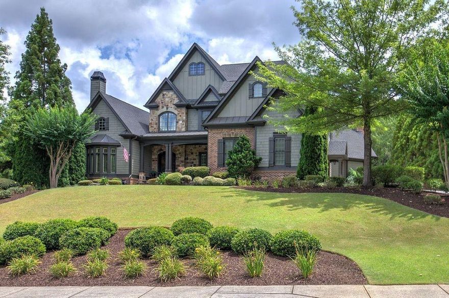 Just reduced $100,000K! Rare opportunity to find a house in this small enclave of executive homes!  Your home tour begins with the wrought iron double door into the 2 story foyer with shining marble floors. The dining room can seat 12+ easily and still not feel tight. The family room has a marble fireplace, built-ins with custom antiqued glass, coffered ceiling and views out to the screened porch and expansive pool area. The kitchen is definitely one of a kind with stone countertops, white cabinetry, SS KitchenAid appliances, breakfast bar/island, custom lighting and view to both the breakfast area and keeping room. The keeping room has a soaring stone fireplace and built in cabinetry that houses a huge TV that stays! Venture to the other side of this main level to see the den with built-ins, fireplace number 3 and a soaring ceiling. The powder room is next and from there the main bedroom. The main bedroom is HUGE and has fireplace number 4, sitting room and double treyed ceiling. The main bath is oversized luxury with separate shower, jetted tub, large vanity with tons of storage, private toilet area and walk-in closet with custom cabinetry. Upstairs you will find a loft area with built-ins, 4 bedrooms each with their own private bathroom and step up to a bonus room/add'l bdrm w/fireplace #5.  Let's check out the finished bsmt that has a full size custom bar (which could become a kitchen), pool table room, movie theater room, wine cellar, 6th bedroom with full bath and an exterior door out to a parking pad (ideal for an in-law suite), exercise room, family room and wait there's more! A workshop w/storage that also has plumbing if you need to add another washer/dryer. We haven't even talked about the screened in porch off the kitchen that has fireplace number 6, outdoor TV and wired for sound PLUS step out to the mini courtyard with water fountain. From here you enter your backyard paradise. Large saltwater in-ground heated pool with waterfall feature, slide, rock diving board and freshly done pool decking. At the back of the property is a raised bed garden area and beyond that an add'l green space to create a playground or use your imagination. Better HURRY!