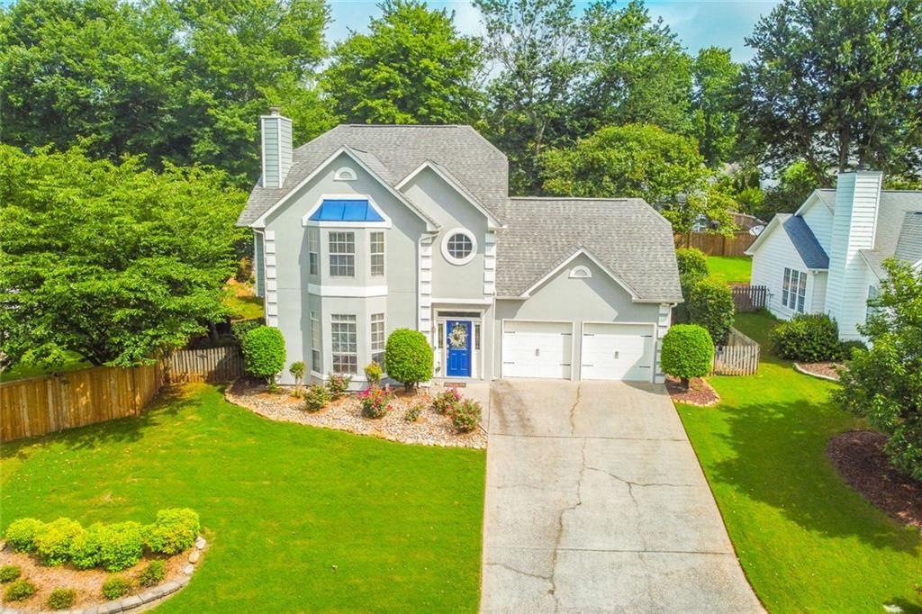 Located at 655 Ruxbury Court in the desirable Suwanee, Georgia, this attractive property presents an exceptional residential opportunity. Enjoying great condition, this home offers a harmonious blend of comfort and style. The living room offers an inviting atmosphere, highlighted by a fireplace, tray ceiling, and crown molding. Envision evenings spent in this welcoming space, where the fireplace creates a warm glow and the architectural details add a touch of sophistication. The updated kitchen is equipped with a backsplash, stone countertops and a kitchen breakfast bar. The design offers both functionality and aesthetic appeal. This single-family residence features four bedrooms and two and a half bathrooms, providing ample space for comfortable living, with a total living area of 2346 square feet. This property offers a blend of classic design and modern convenience. With its desirable features and prime location, this Suwanee residence is poised to become your personal haven.
