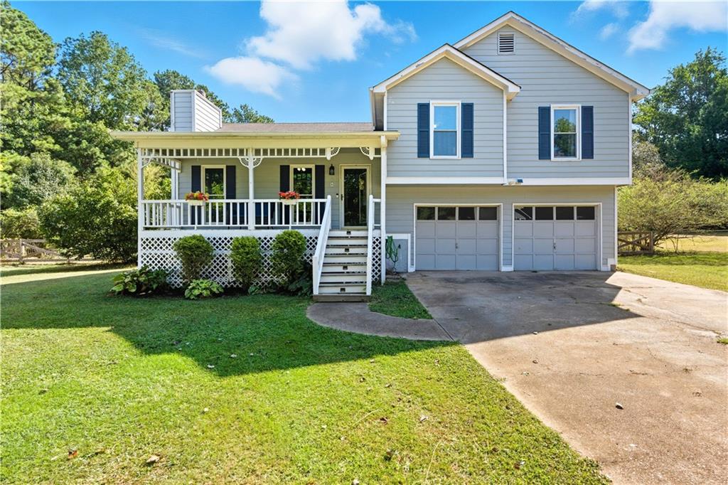 Welcome to 8 Sumer Ln N in Douglasville. This 3-bedroom, 2-bath home sits on a half-acre cul-de-sac lot and combines practical updates with inviting outdoor features. Inside, you’ll find an updated kitchen, fresh interior paint, and new bedroom windows. The 2-car garage provides secure parking and storage, while the outbuilding offers even more space for tools, hobbies, or seasonal needs. A covered, rocking-chair front porch sets the tone for relaxed living, and the fenced backyard is ready for entertaining with an above-ground pool and deck. This home is conveniently located near schools, shopping, and parks. *Even better, it comes with an assumable FHA mortgage at 3.625% interest—a rare opportunity to lock in a lower rate. The seller is also offering $5,000 toward flooring replacement, giving buyers the chance to choose finishes that suit their style. *Contact us today to learn more and schedule your showing.