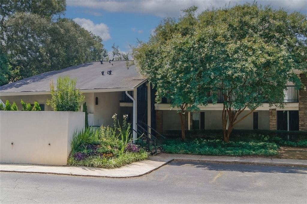 Enjoy tree-top views from this beautifully updated top-floor condo just minutes from downtown Atlanta. Relax on your private back balcony surrounded by mature trees with views of the picnic tables and walking trails. The kitchen has freshly painted white cabinets, newer granite countertops, a designer backsplash, new black
and stainless-steel appliances, a new water heater, new stackable washer and dryer, new faucet, and more. This light-filled corner unit features real ¾-inch oak hardwood flooring throughout and extra windows for abundant natural light. The spacious family
room flows into a charming breakfast area, and the seller has added recessed lighting throughout along with stylish newer fixtures, new dimming light switches, updated
outlets, and fresh paint. The bathroom includes white granite countertops, new water saving toilet, newer faucet, modern lighting, and updated flooring, while a generous walk-in closet provides plenty of storage. Fresh paint makes this home truly move-in
ready. The gated community offers a pool, clubhouse, sand volleyball court, dog park, gym, car detailing station, and a large lawn area. The home is conveniently located near one of the gates for easy guest access, and you can enjoy views of the community right
from your covered porch. The location is unbeatable—just minutes to the interstate, grocery stores, and within walking distance to many great restaurants and shops.