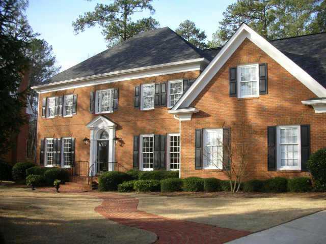 Beautiful 'Buckhead home' in popular Baldwin Farms swim/tennis neighborhood. Brick home has lovely level yard w/fenced back, side entry garage plus parking pad for 2 extra cars. Finished terrace level has family room, wetbar, bedroom, full bath.