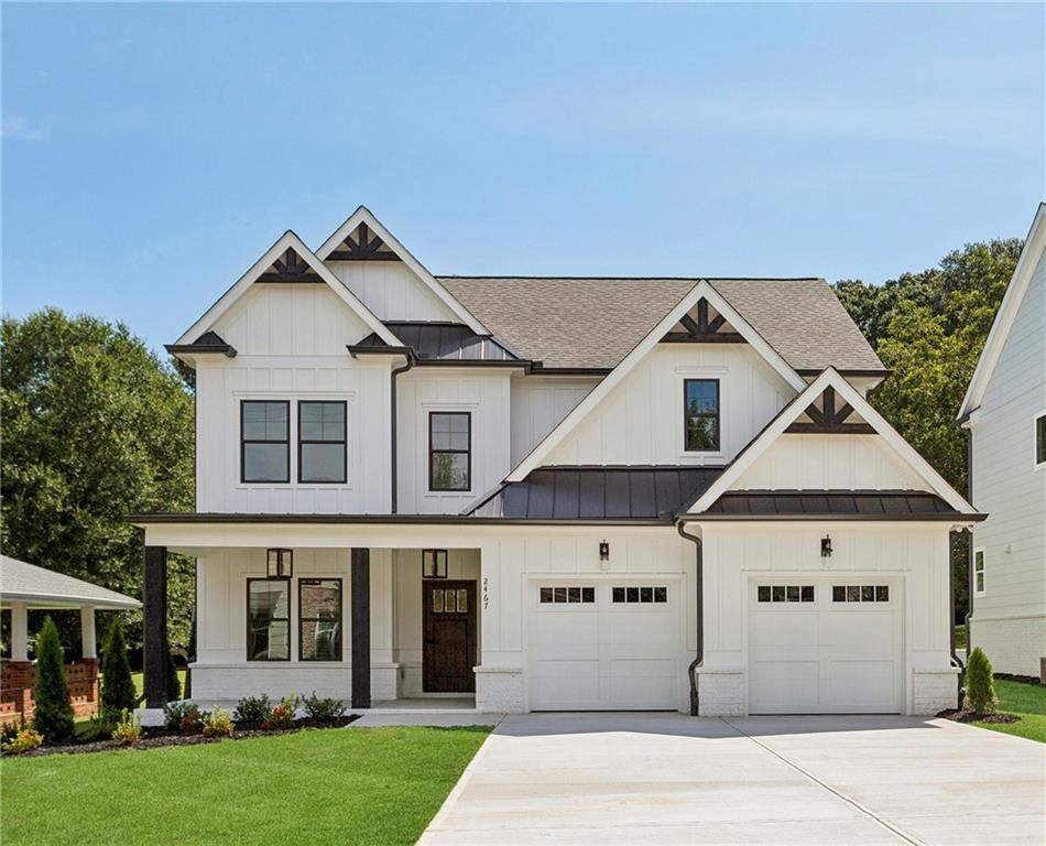 New Construction next to popular Williams Park! So convenient to the Smyrna Market Village and the Battery! This impressive modern farmhouse/craftsman-style home features a gorgeous stained wood front door, a 4-sides brick water table with a board-and-batten front, covered front and rear porches, and a HUGE professionally landscaped yard. The interior offers a dining room with a beamed ceiling, site-finished hardwood floors, an open kitchen with high-end quartz countertops, stainless steel appliances, an enormous island opening to the large family room, and a bedroom/study on the first floor. Upstairs, you'll find a lovely master bedroom and bath, two additional spacious bedrooms, a sizable hall bath, and an enormous loft/media/playroom + bonus room. This impressive home's included upgrades and finishes are just "icing on the cake". This one is a winner for sure!