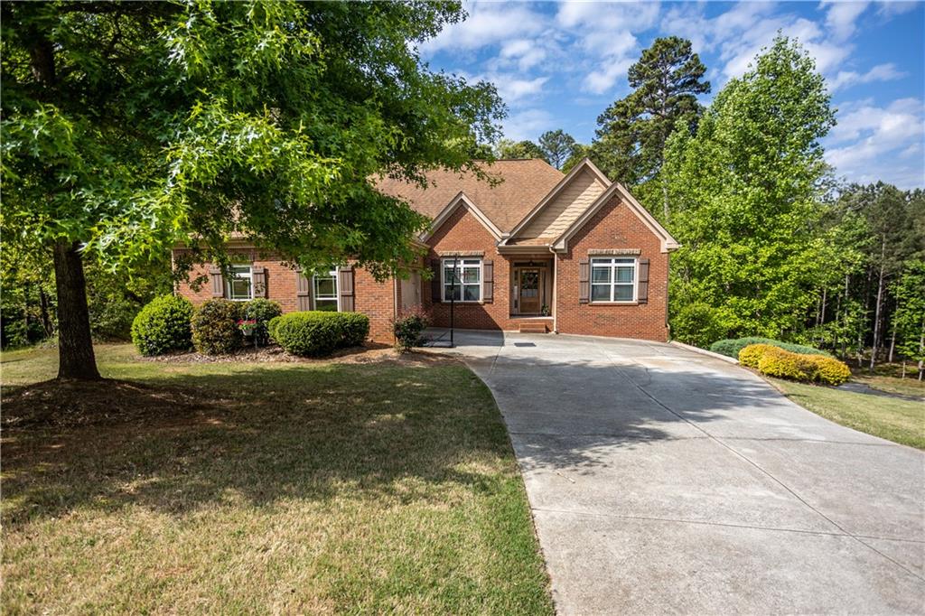 Beautiful 5 Bedroom 4 Bath Traditional Home with Spacious Finished Basement on 2+ acres in quiet Hickory Grove Estates. Granite counter tops, stainless steel appliances and refinished hardwood floors. Master on main with 2 secondary bedrooms. Upstairs has 1 bedroom, full bath, and additional large bonus room. Basement has full bath, bedroom, living/media room, office, and game/rec room. Perfect house for entertaining, in-law suite or more! Large fenced-in private backyard. Don't miss your opportunity to make this your new home!