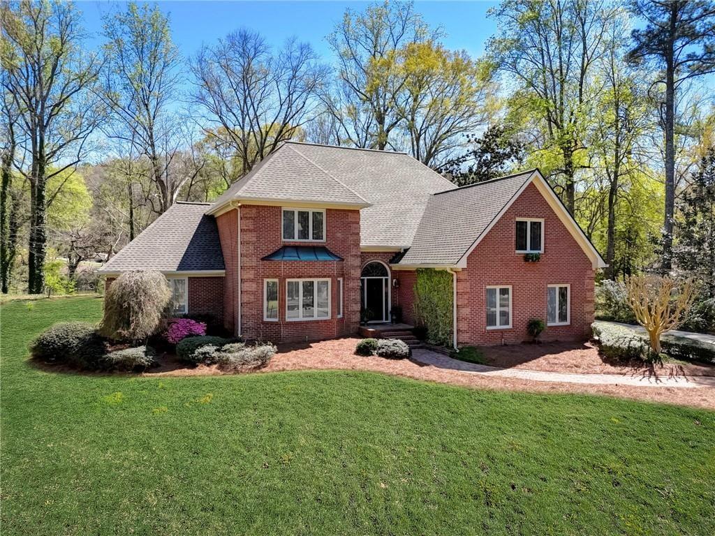 Gorgeous 4 Bedroom, 3.5 bath brick home on the banks of Chattahoochee River in reward winning Walton/Dickerson/Sope Creek School Districts. This house is truly a nature lovers paradise with backyard access to canoeing and fishing on the river. 2 story foyer, formal living room which could be used as an office. Family room with cathedral ceiling and fireplace opens to dining room with a view of private backyard and Chattahoochee River. Master on main in addition to 3 bedrooms and a large bonus room upstairs. New interior paint throughout.