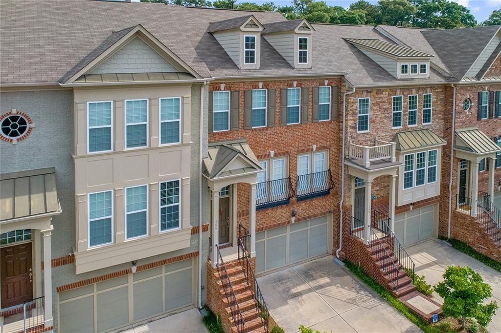 This spacious Buckhead townhouse is located in the heart of it all! Home ideally located in south Buckhead/north midtown, walking to your favorite restaurants and shops, minutes to beltline. Upon entering home, you are greeted by views into the expansive living room and breakfast nook, which flow into the open kitchen with island, making it perfect for entertaining. Upstairs, the master bedroom features an oversized walk-in closet and large bathroom with soaking tub, laundry room on the hallway, and a second bedroom with full bath. Terrace level featuring an additional bedroom and full bathroom just off the garage. Back yard/deck opens/overlooks to the large community courtyard with outdoor fireplace. You don't want to let this home pass you by!