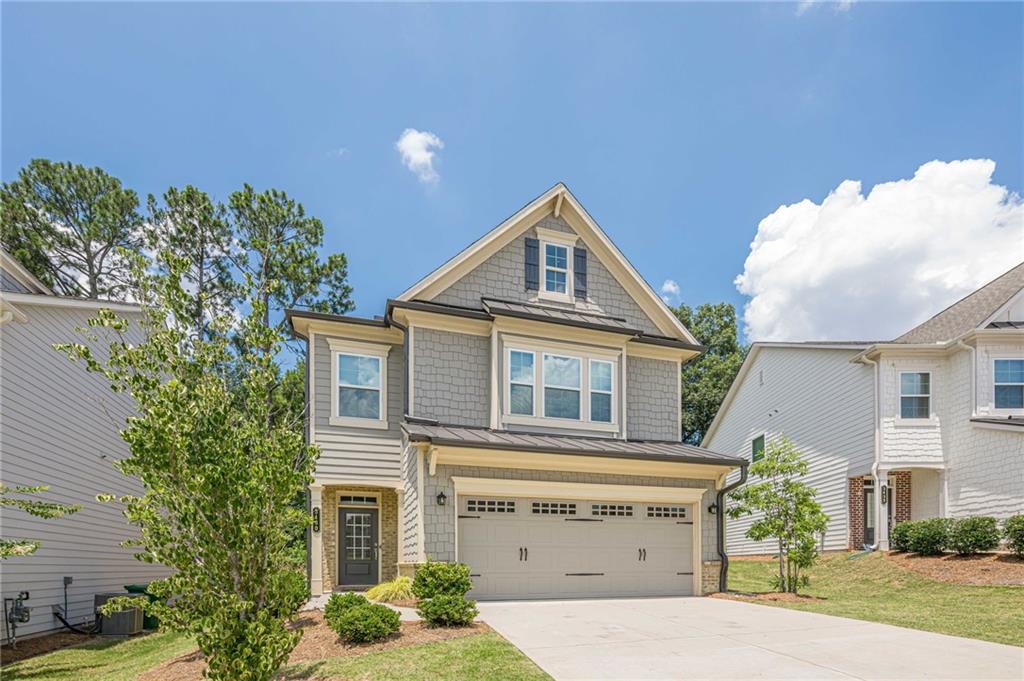 Nearly new and immaculate 4 bedroom, 2.5 bath home in sought-after Envoy at Decatur is an entertainer’s dream and your lawn maintenance is taken care of for you! Minutes to Decatur Square, Dekalb Farmers Market, Emory University/Village, dining, entertainment, the CDC, Tobie Grant Rec Center, all major expressways and everything that Atlanta has to offer! Features include open-concept main level living areas with abundant natural light and gorgeous luxury vinyl plank flooring! Gourmet granite and stainless kitchen with gas range/oven, plenty of cabinetry and counter space, huge center island with breakfast bar and convenient storage drawers, tile backsplash, and separate pantry! Family room with gas fireplace, dining area and views to level wooded back yard! Primary Suite with trey ceiling, updated lighting, spa bath with soaking tub, dual vanities, oversized tile shower and enormous closet with custom built-ins! Three secondary bedrooms have ample space for family, guests, or a home office! Well-maintained, immaculate property also features upgraded shelving in pantry, bedroom closets, and garage plus easy-care epoxy finished garage floor, instant hot water, smart digital thermostats, entryway shoe organizer and more! Beautifully landscaped level lot with back and side yards perfect for kids, pets and relaxing with friends and family! Lawn maintenance included in monthly fees! Easy living inside the Perimeter convenient to everything! Call to schedule your private tour today!