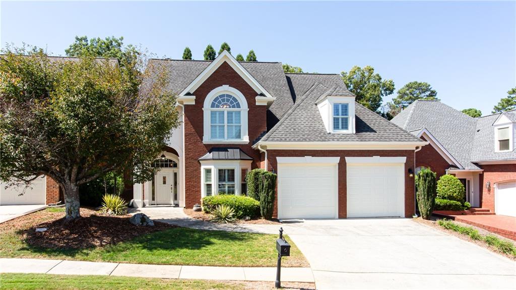 Stunning 4-Sided Brick Home in a Gated Community. Located in one of the area's most sought-after gated neighborhoods and top-rated school districts, this home blends timeless charm with modern upgrades. The main level features a spacious primary suite with dual closets, a relaxing jacuzzi tub, and a separate shower. The elegant family room boasts a hand-painted fireplace, while the gourmet kitchen offers granite countertops, custom cabinetry, and upscale finishes throughout. Upstairs you'll find two oversized bedrooms connected by a shared bath, each with private sink areas, plus a large bonus room perfect for a 4th bedroom, home office, or recreation space. Plantation shutters and designer decor elevate every room. Step outside to your private oasis-a gorgeous, level backyard with a pergola, serene pond, and covered patio ideal for entertaining or quiet relaxation. All just minutes from top schools, shopping, dining, and the hospital-this home truly has it all!