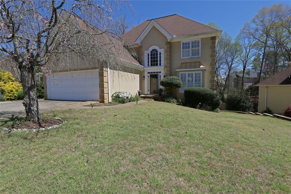 Nestled in a well-established swim and tennis community within the highly sought-after Lanier High School district, still recognized in 2025 for its excellent academics and vibrant programs. The open-concept layout features hardwood floors, a spacious kitchen with granite countertops and stainless-steel appliances, a vaulted eat-in area, and a screened sun porch overlooking a large, private lot. The luxurious master suite boasts a spa-like bath with quartz countertops, and the finished basement offers additional living space with a bedroom and bath, perfect for guests or a home office. Located just minutes from the shopping and dining of Suwanee and Sugar Hill, this home offers modern comfort, top-rated schools, and access to outstanding community amenities in one of the area's most desirable neighborhoods.