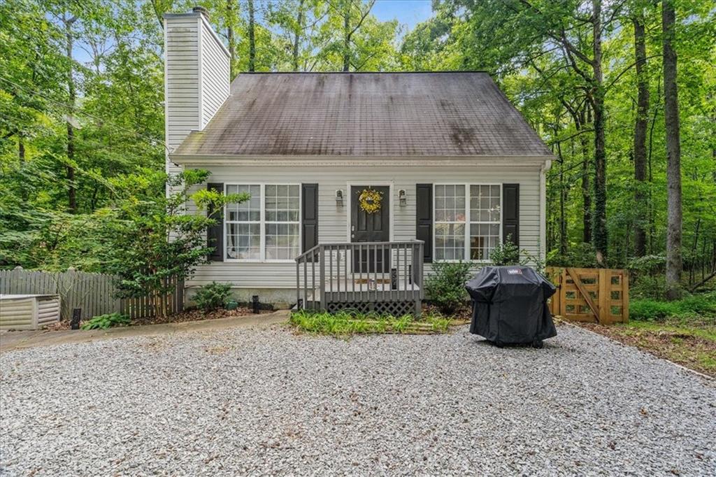 Discover charm and convenience in this beautifully updated 3-bedroom, 2-bath home, complete with a versatile bonus room that can serve as an office, playroom, media room, or even a 4th bedroom. The open layout features stylish LVP flooring, a bright kitchen with quartz countertops, and stainless-steel appliances. A cozy wood-burning fireplace makes the living space warm and inviting. Set on a serene lot, this property offers privacy and natural beauty. The private backyard is ideal for entertaining or simply relaxing outdoors. Located just minutes from Hwy 400, premier shopping and dining, Northside Hospital, Lake Lanier, and Tidwell Park, and zoned for highly rated Forsyth County schools. As a bonus, the voluntary HOA offers private, gated boat access to Lake Lanier a rare find! Don’t miss your chance to make this wonderful home your own!