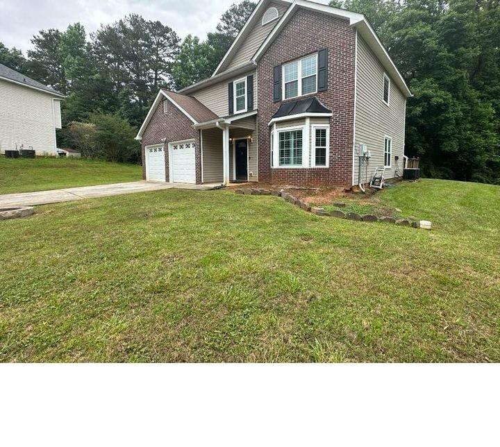 Dear Future Homeowner: I have LOVEDDD this home and the amount of space that an acre of land provided me. It's like I'm in my own world no matter how crowded Atlanta gets. And it'll be PRIVATE since you'll own most of the cul-de-sac. I imagine you'll have beautiful private gatherings here like your daughter's wedding or the family reunion one year. My favorite interior feature is how my loft area overlooks my 2 story family room. It's THE picturesque landing for photos-I hope it'll be that for you also on your childrens' prom night or wedding day. Memories :) We have a separate formal dining room, separate living room and an eat-in kitchen adjoined by a back deck to give us plenty of room to celebrate each of those landmarks, as I'm sure you'll use to do the same. Our primary suite boasts tray ceilings with French doors opening to a en-suite bathroom with his and her sinks. Every window is new, freshly painted throughout and the garage is fully insulated. Everything you need to start your new chapter. ELIGIBLE FOR 100% Broker's agent is contributing $1000K towards new appliances or $580 for a 1 year home warranty (only with full offer).