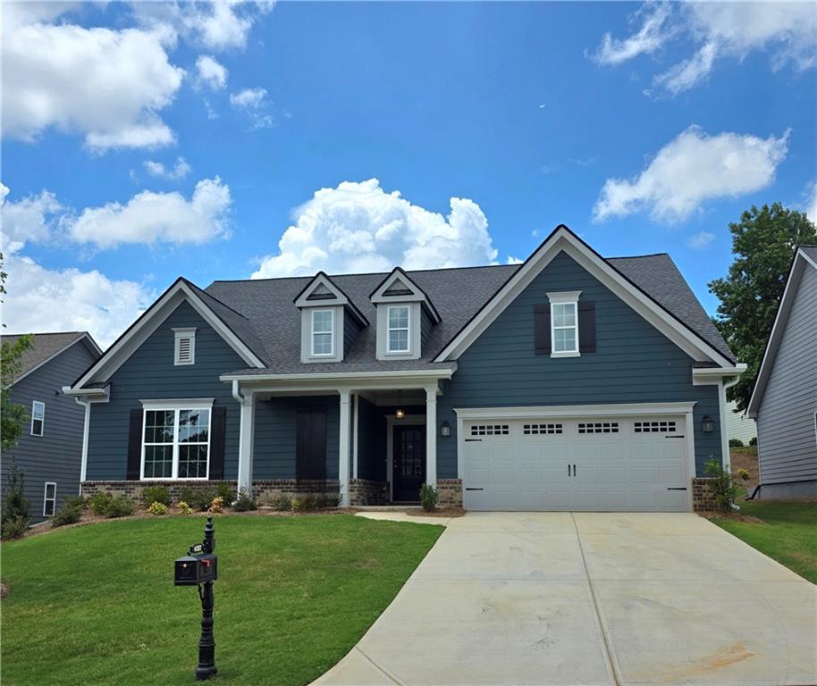 Final Opportunities to Own in Traditions of Braselton at this Value! Beautiful Ranch-Style Home in the Tranquil Golf Course Community of Traditions of Braselton! Welcome to your dream home in the prestigious Traditions of Braselton golf course community! This stunning ranch-style home offers the perfect blend of modern luxury, timeless elegance, and a serene community setting. Key Features: Master on Main: This home boasts a spacious master suite on the main level. The kitchen is a dream, featuring granite countertops all surfaces, stainless steel appliances, and ample cabinet space. It's a central hub for gatherings. Upgrades included: Laminate floors in main living areas, and upgraded fixtures, adding to its elegance and charm. Spacious Bedrooms: this home offers generously sized secondary bedrooms, an upstairs oversized bedroom, and a full bathroom. Modern Amenities: Traditions of Braselton offers a variety of amenities, including a golf course, swimming pool, tennis courts, and a clubhouse, ensuring a lifestyle of luxury and leisure. Conveniently located near shopping, dining, and top-rated schools. The vibrant community of Braselton/Jefferson offers a welcoming community with a small-town feel. Don't miss your opportunity to own this exceptional ranch-style home in Traditions of Braselton. Whether you're an avid golfer or simply looking for a peaceful and beautiful place to call home, this property has it all. Schedule a showing today and experience the epitome of refined living in Jefferson, Georgia. Your dream home awaits! Preferred lender Incentives available Built By: Northside Commons Builders **Stock Photos**
