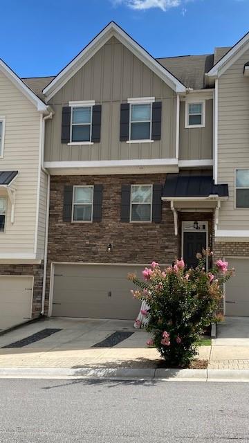 This gorgeous 3 bedroom townhome offers with finished bedroom suite on the terrace level. Main living space has open floor plan with hardwoods throughout and french doors that lead out to oversized deck, perfect for all of your entertaining needs! The beautiful kitchen has 42" cabinets, SS appliances and granite countertops. Upstairs offers 2 huge master suites with walk in closets!