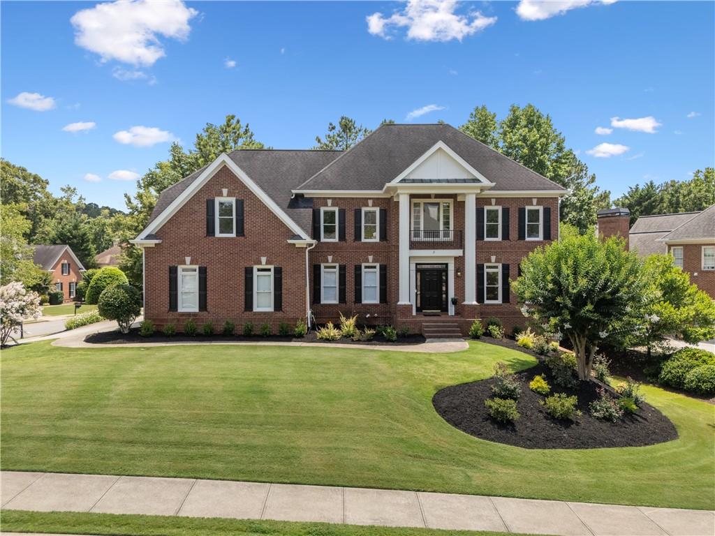 Welcome to this stunning four-sided brick traditional home, thoughtfully updated with modern finishes throughout and ideally situated on a fantastic corner lot just off a quiet cul-de-sac in Milton’s premier gated swim, tennis, and golf community—Crooked Creek. Located on one of the most sought-after streets in the neighborhood, Majestic Cove, this home offers timeless curb appeal and exceptional upgrades inside and out. As you enter, the impressive curb appeal sets the tone for what’s to come. Off the entry foyer, you'll find a dedicated office with custom built-ins that can also function as a guest bedroom thanks to its attached full bath. Nearby, the sun-filled formal living and dining rooms provide flexible space for everyday use or entertaining. At the heart of the home, the fully renovated kitchen features custom cabinetry, a spacious new walk-in pantry, and a smart, open-concept layout that flows effortlessly into the fireside family room and casual dining area. Step outside to enjoy a brand-new deck that extends your living space—perfect for relaxing evenings or entertaining under the stars. Throughout the home, you’ll find new hardware and fixtures in every room, updated light switches and baseboards, fresh interior paint, and beautifully refinished hardwood floors on both the main and upper levels. Upstairs, the oversized primary suite is a true retreat featuring hardwood floors, a cozy fireplace, and a luxurious spa-like bathroom with heated floors, a soaking tub, a frameless glass shower, a dedicated in-line water heater, and a custom walk-in closet system. Secondary bedrooms also feature hardwood flooring and have been updated with stylish modern bathrooms and generous closet space. The finished terrace level adds even more versatility and room to spread out, featuring brand-new luxury vinyl plank flooring, a full bedroom and bathroom, a kitchenette, and open flex spaces ideal for working from home, fitness, or movie nights. You'll also find an expansive craft room and workshop, perfect for any hobbyist, along with one of the home’s three fireplaces to round out the cozy vibe. Additional upgrades include four Nest thermostats for multi-zone temperature control, a new laundry room floor and utility sink, two new exterior doors, new garage doors, a fully fenced backyard, and newer mechanical systems including HVAC and water heater. The oversized three-car garage provides ample space for storage, hobbies, and everyday convenience. Tucked away on a quiet street near the back of the neighborhood, you’re just minutes from top-rated schools, downtown Alpharetta, and everything Milton has to offer. Crooked Creek residents also enjoy access to world-class amenities including golf, tennis, swimming, pickleball, Basketball and an active calendar of events for all ages. You don’t want to miss this one!