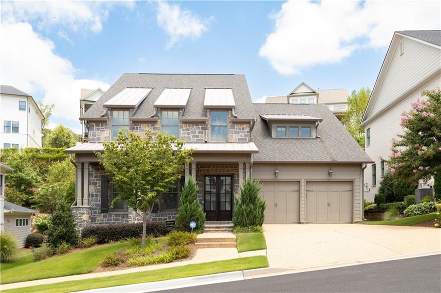 MOVE-IN READY! Welcome to Hillandale, a new construction community by award-winning Patrick Malloy Communities, inspired by the timeless charm of Charleston. The Windham C plan offers a luxurious layout with the owner’s suite on the main level, featuring a stunning stone exterior, gas lanterns, and refined Southern architecture.

Enjoy a chef’s kitchen that opens to a fireside family room, perfect for entertaining or relaxing. Step outside to a private backyard retreat with a covered patio and serene stone koi pond.

Upstairs, you’ll find spacious secondary bedrooms, a loft, and designer finishes throughout—including custom built-ins, exposed beams, elegant cabinetry, and high-end tile selections.

Live with ease, just minutes from Historic Roswell and the Chattahoochee Nature Center.

Windham C – Hillandale. Southern living, redefined.