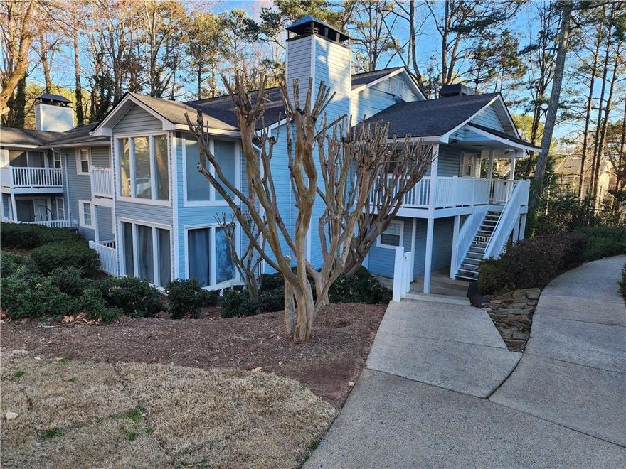 Nestled in a serene setting, this beautiful home is perfect for nature lovers.The 2 bedroom, 2 bath, modern condo has so much to offer. The chef’s kitchen is a standout with ample cabinetry, a spacious island, a gas range, and sleek hard-surface countertops.  The sunroom offers versatile space, ideal for a home office or relaxation area. Step outside to a private deck — perfect for entertaining! The community boasts amenities, including a pool, scenic walking trails, pet-friendly options, and plenty of parking available. The HOA fee covers water, sewer, trash pickup, exterior and community maintenance, and pool... ensuring hassle-free living! This prime location offers easy access to Truist Park and The Battery Atlanta for Braves games, the Chattahoochee River for scenic hikes, and top employers like Dobbins Air Reserve Base and Lockheed Martin. Kennesaw State University, Life University, and major highways including I-75 and I-285 are all within reach. Downtown Atlanta and Hartsfield-Jackson International Airport are also just a short drive away. Experience the perfect blend of privacy, modern updates, and unbeatable convenience — your ideal home awaits