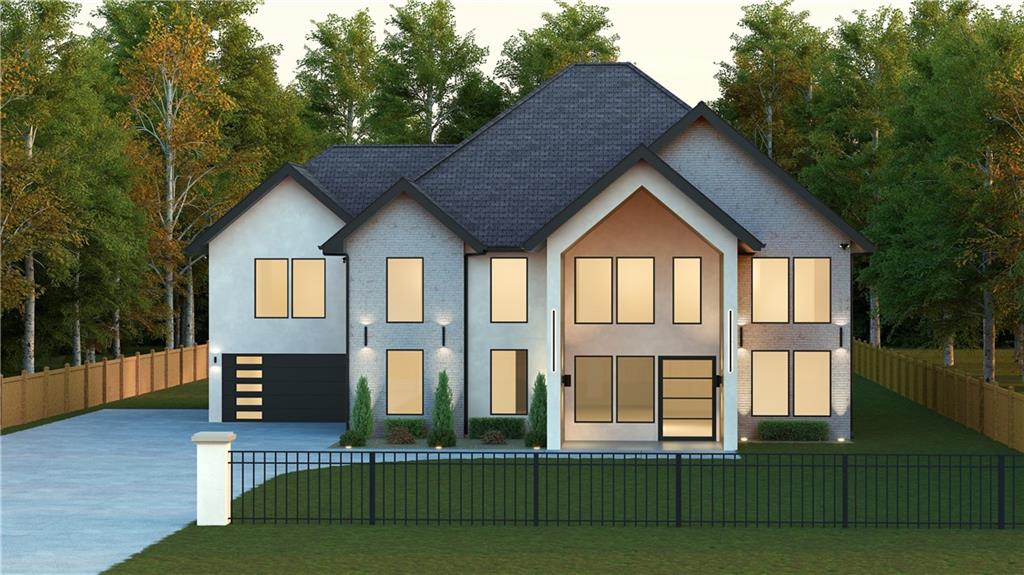 Contemporary home featuring a fenced front yard, brick siding, and concrete driveway